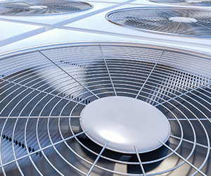close up of large commercial HVAC system with fans blowing
