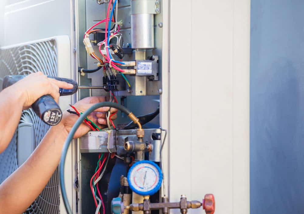 A professional from Bud Matthews performs HVAC repair for a client in Fearrington North Carolina