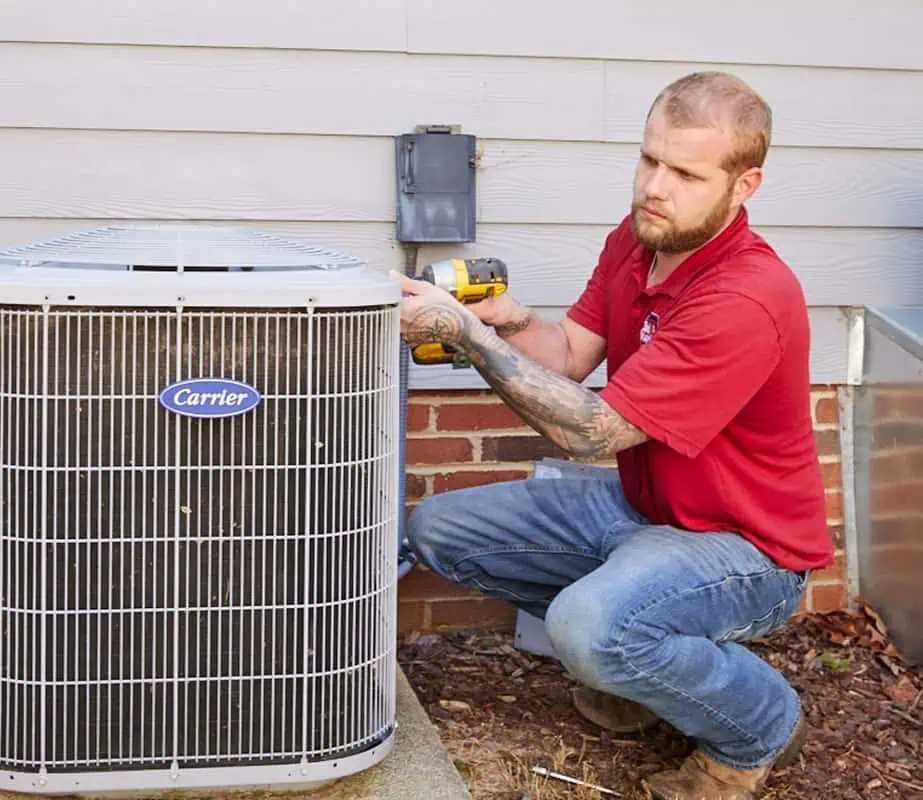 Bud Matthews Employee Fixing Aircon